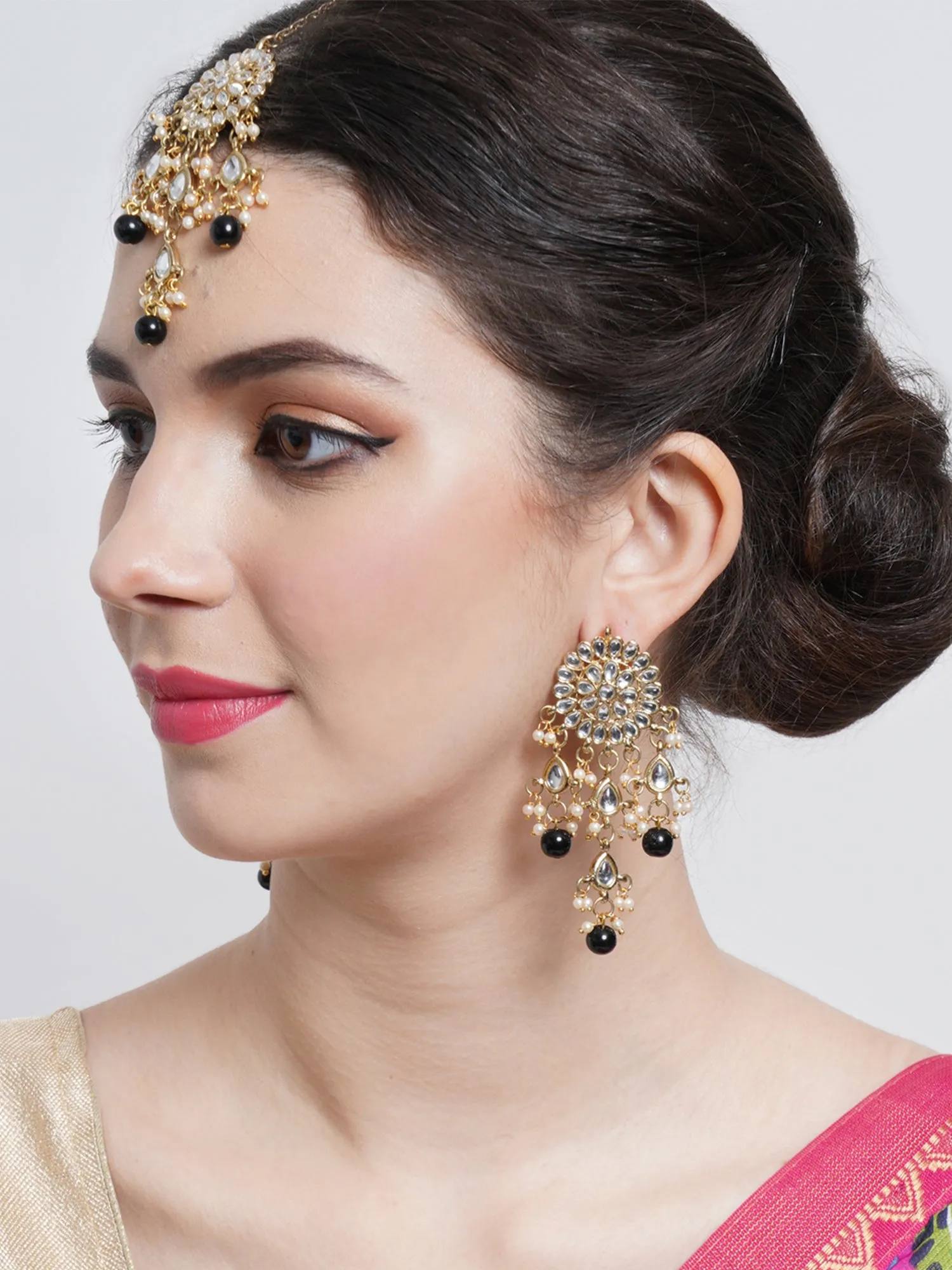 Gold Plated Embellished Black Kundan Tassel Earrings with Maangtikka