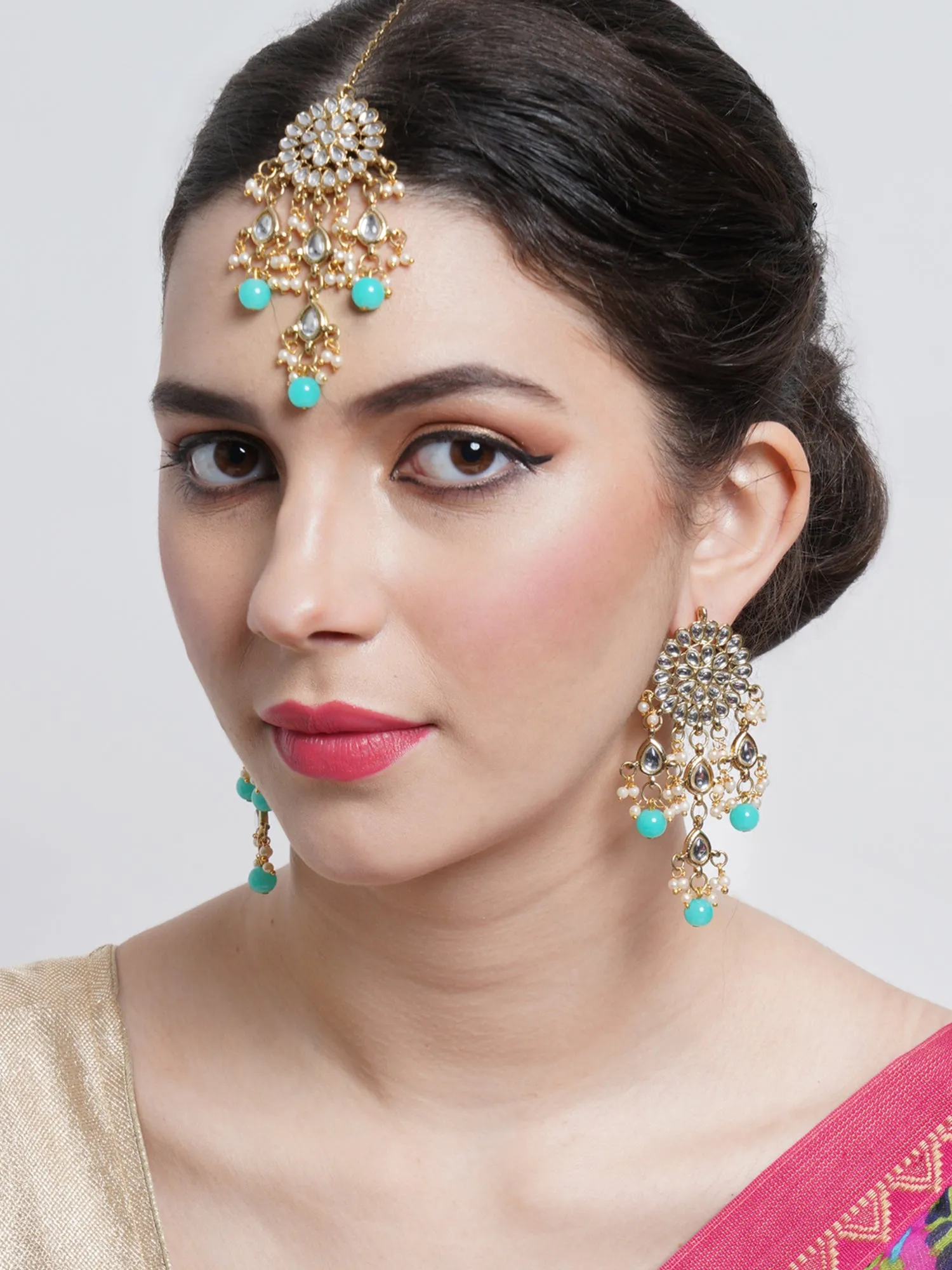 Gold Plated Embellished Light Blue Kundan Tassel Earrings with Maangtikka